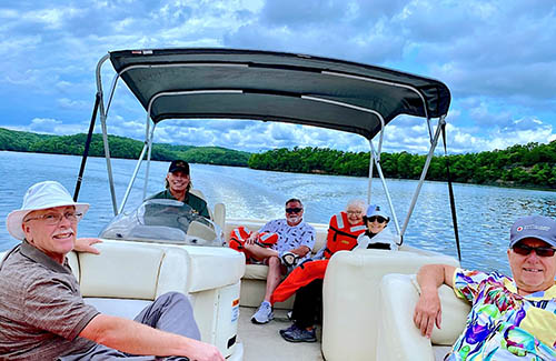 Group Taking Pontoon Boat Ride through LAke of the Ozarks Aquatic Trail